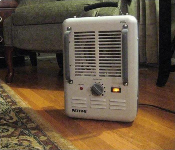 Space heater on a living room floor.