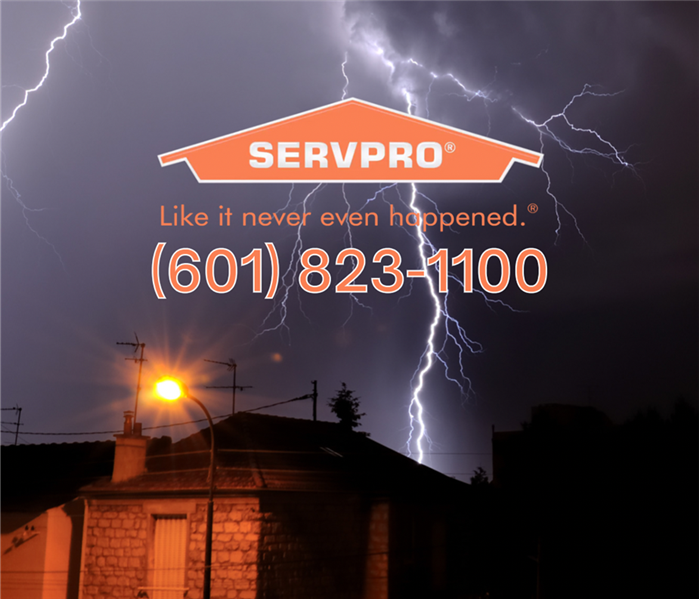 Lightening striking over a house, with the company logo and number attached to the image: 601-823-1100.