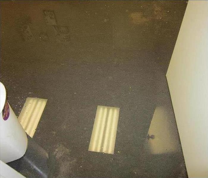 Flooded floor space in an office.